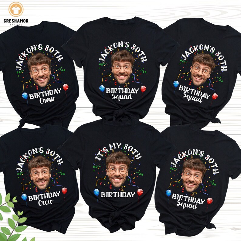 May include: Six black t-shirts with a birthday theme. Each shirt features a different design with a person's face in the center. The text on the shirts reads "Jackson's 30th Birthday Crew", "Jackson's 30th Birthday Squad", "It's My 30th Birthday", and "Jackson's 30th Birthday Squad".