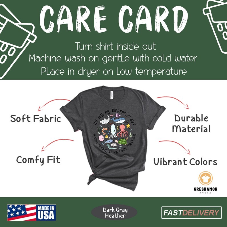 May include: Dark gray heather t-shirt with a graphic of colorful sea creatures and the text "We are all different but in this school we all swim together". The shirt is made in the USA and has a care card with instructions for washing and drying.