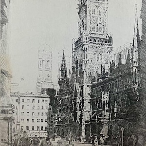 May include: Black and white etching of a European city street scene, featuring tall buildings and a prominent church tower. The word "MUNCHEN" is printed at the bottom. Signed by the artist.