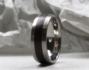 Titanium and Carbon Fibre Wedding Ring Matt Finish, Court Shape. Comfort fit inside. Titanium and carbon fibre wedding ring.