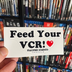 Adesivo in vinile "Feed Your VCR"