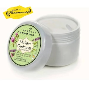 May include: A white jar of Mullein ointment with a green and white label. The label includes the text "Mullein Ointment" and the ingredients. A yellow sticker that says "made by Pharmacist" is in the upper left corner.