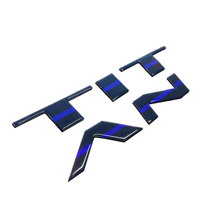 May include: Black and blue car emblem with the letters "TRZ" in a stylised font.