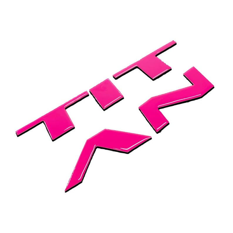 May include: A pink plastic emblem with the letters "XT2" in a bold, stylised font.