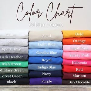 May include: Color chart of Gildan 18000 apparel in various colors. The chart displays folded sweatshirts in shades of white, gray, blue, green, and more. Text labels identify each color, including "White," "Black," and "Red."