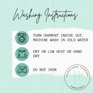 May include: A white background with the words "Washing Instructions" in cursive script. Below are washing symbols and instructions: turn garment inside out, machine wash in cold water, dry on low heat or hang dry, and do not iron. A logo for Hometown Threads Embroidery is in the bottom right.