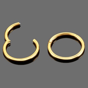 Gold anodized surgical steel clicker ring piercing