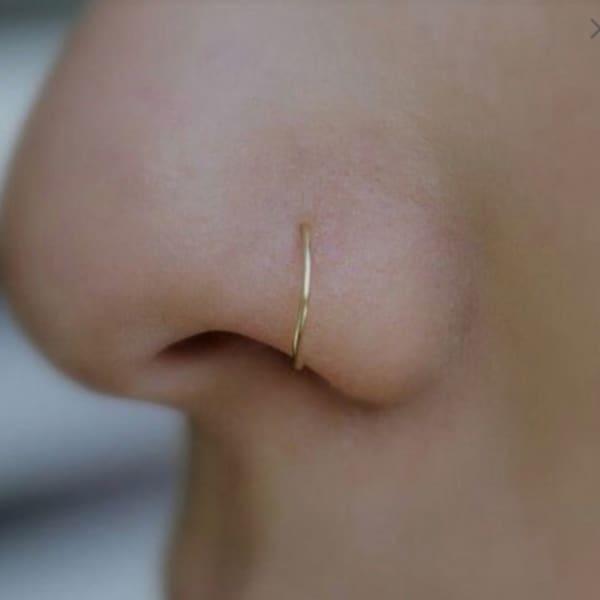 Gold nose ring piercing, gold nostril piercing