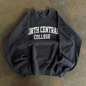 Vintage Y2K MV Sport Tag North Central College Spellout Big Logo Printed Crewneck Pullover Sweater College Apparel Colour Black Size Medium