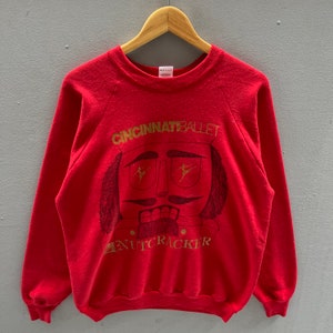 Vintage 90s Fruit Of The Loom Tag Cincinnati Ballet Nutcracker Spellout Biglogo Printed Sweatshirt Crewneck Colour Red Size X-Large