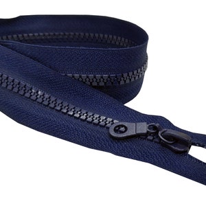 May include: A navy blue zipper with a black plastic slider and pull tab. The zipper is closed and the pull tab is at the end of the zipper.