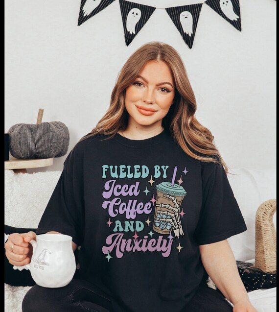 Fueled By Iced Coffee & Anxiety Women's T-Shirt - Funny Graphic Tee With Leopard Messy Bun Design