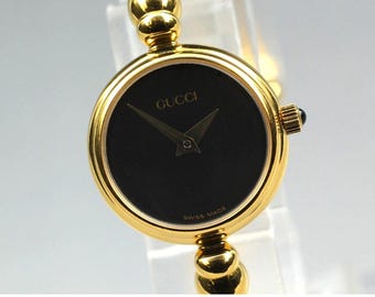 Vintage Gucci Womens watch gold bangle swiss made quartz pre owned authentic