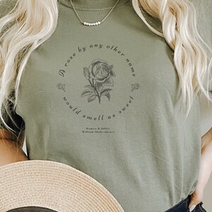 May include: A green t-shirt with a black graphic print of a rose and the text "A rose by any other name would smell as sweet" with the attribution "Romeo & Juliet William Shakespeare".