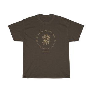 May include: A brown t-shirt with a gold graphic of a rose and the text "A rose by any other name would smell as sweet" by William Shakespeare.