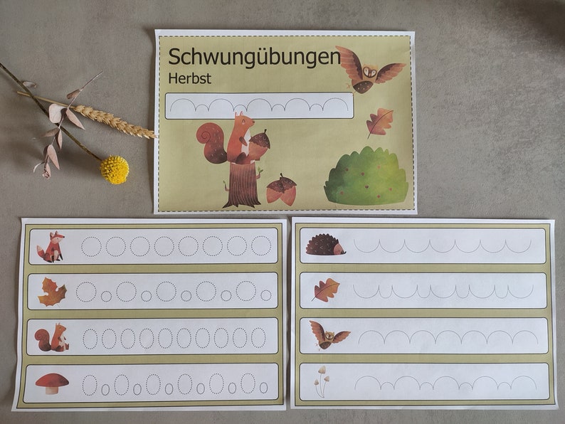 May include: Four worksheets with dotted lines for tracing. The top worksheet has a squirrel, acorns, and the text "Schwung&uuml;bungen Herbst". The other worksheets have a fox, a leaf, a squirrel, a mushroom, a hedgehog, a bat, and a flower.