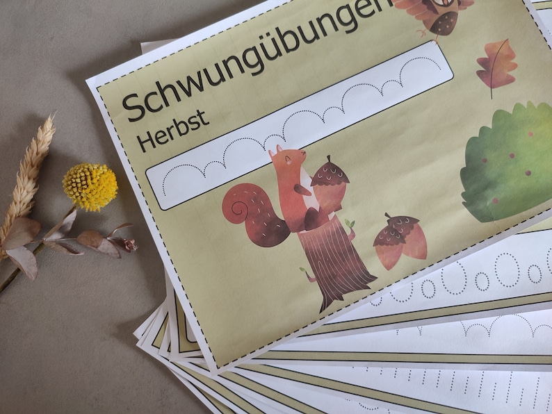 May include: A set of printable worksheets for kids to practice their handwriting skills. The worksheets feature a squirrel holding acorns and the word "Schwing&uuml;bungen Herbst" which translates to "Swing Exercises Autumn".