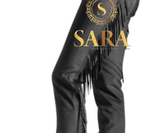 May include: Black leather chaps with fringe detailing. The chaps feature a belt and buckle closure at the waist and are designed to be worn over pants. The image includes the text "SARA" in a gold emblem.