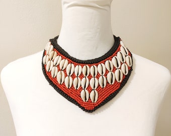 Statement Cowrie bib necklace.