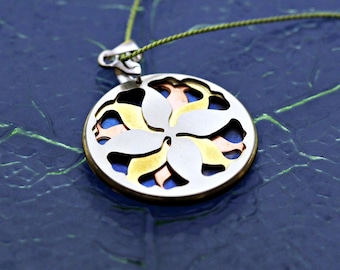 Large leaf mandala necklace in blue, orange, yellow, and silver tones.