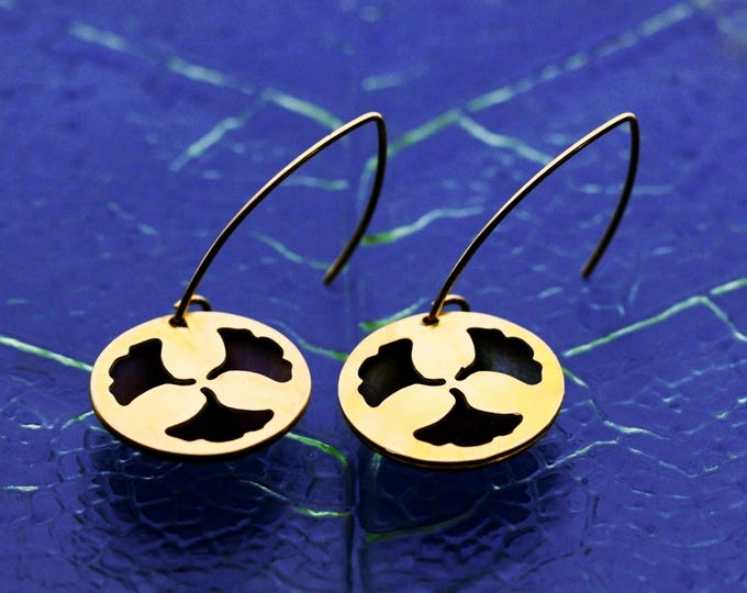 Round hoop earrings with a ginkgo leaf motif, in blue and gold tones.