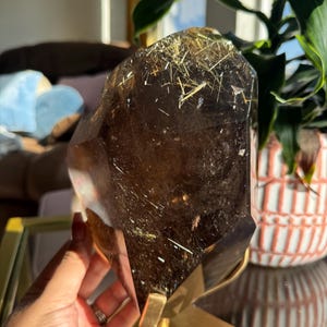 Polished Golden Rutilated Smoky Quartz Freeform with Hematite and Gold Rutile Stars (4.8kg) - Stunning translucency- on rotating gold stand