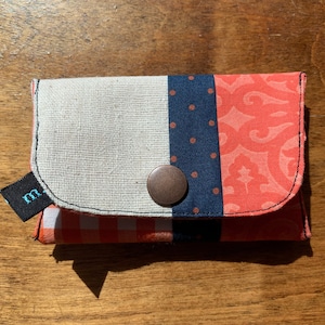 Cartera Snap naranja y azul