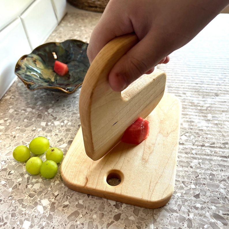 Montessori kitchen, child safe toddler knife, practical life activities, wooden Montessori knife, fine motor skills