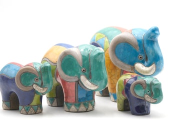 Elephant family in painted raku naive style