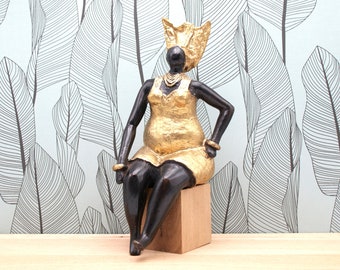 Full-figured woman in golden dress - lost wax bronze