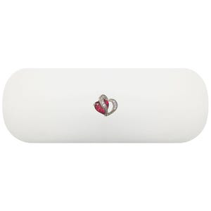 May include: A white, oblong, rounded case featuring a small, centered heart-shaped pendant. The pendant consists of a deep red, heart-cut stone on one side and a silver-toned, curved metal frame accented with small, clear, sparkling stones on the other.
