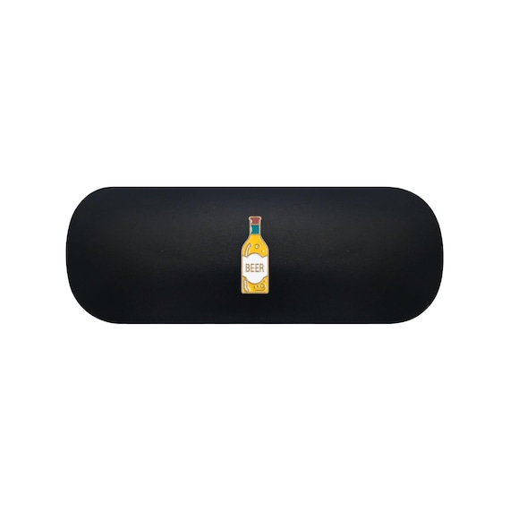 A glasses/sunglasses case shaped and styled like a beer glass — a clever, visually punny object that doubles as a personalised groomsmen gift.