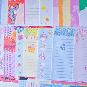 Puede incluir: Una colecci&oacute;n de hojas de papeler&iacute;a coloridas con varios dise&ntilde;os. Las hojas presentan patrones como estrellas, flores y personajes de dibujos animados. Algunas hojas tienen papel rayado, otras est&aacute;n en blanco. El texto "I'm happy Cat" es visible.