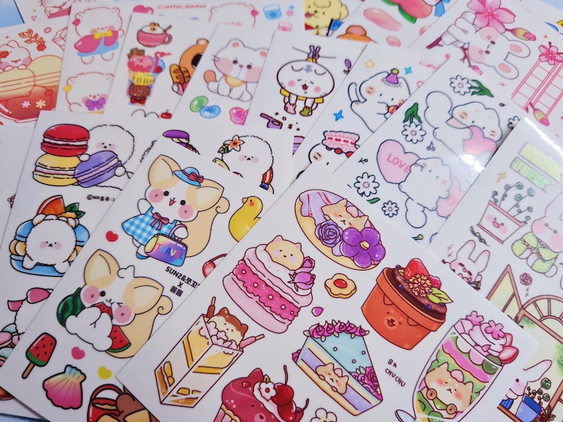 May include: A sheet of colorful stickers featuring cute cartoon animals, desserts, and other whimsical designs. The stickers are perfect for adding a touch of personality to journals, planners, laptops, and more.
