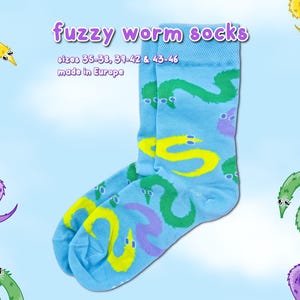 May include: A set of three ceramic mugs with a speckled, matte finish in cream, light grey, and dark grey. Each mug has a simple, minimalist design, ideal for coffee or tea.