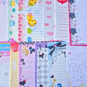 Puede incluir: Una colecci&oacute;n de papeler&iacute;a colorida con varios dise&ntilde;os. Los dise&ntilde;os incluyen gatos de dibujos animados, corazones, notas musicales y otras ilustraciones bonitas. La papeler&iacute;a est&aacute; rayada y es adecuada para escribir notas o cartas.