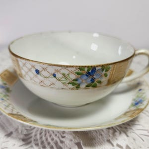 Nippon Teacup and Saucer Set Vintage Hand Painted Blue Flowers Gold Trim