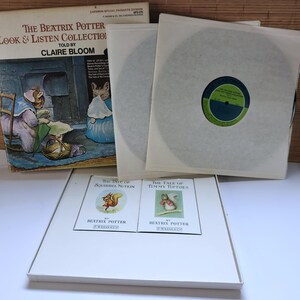 May include: The Beatrix Potter Look & Listen Collection vinyl record set featuring a box with an illustration of a rabbit, two records in white sleeves, and two small books titled The Tale of Squirrel Nutkin and The Tale of Timmy Tiptoes.