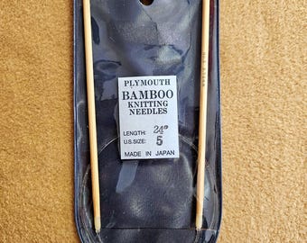 May include: Plymouth Bamboo Knitting Needles, size 5, 24 inches long, in a clear plastic package. The needles are made of light-colored bamboo. The package has a label with the product name and specifications.