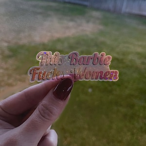 This Barbie F*cks Women- Lesbian Pride Clear Sticker | Holographic Glitter Laminated Waterproof Pride Sticker w/ Transparent Backing image 1