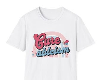 May include: White t-shirt with a rainbow graphic and the text "Cure ableism" in a retro font.