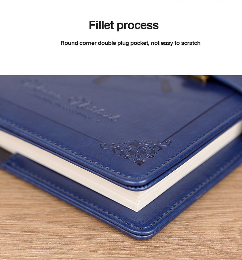 May include: Close-up of a blue leather-bound journal with a decorative design and the text "Vintage Notebook" embossed on the cover. The journal has a rounded corner and a double plug pocket.