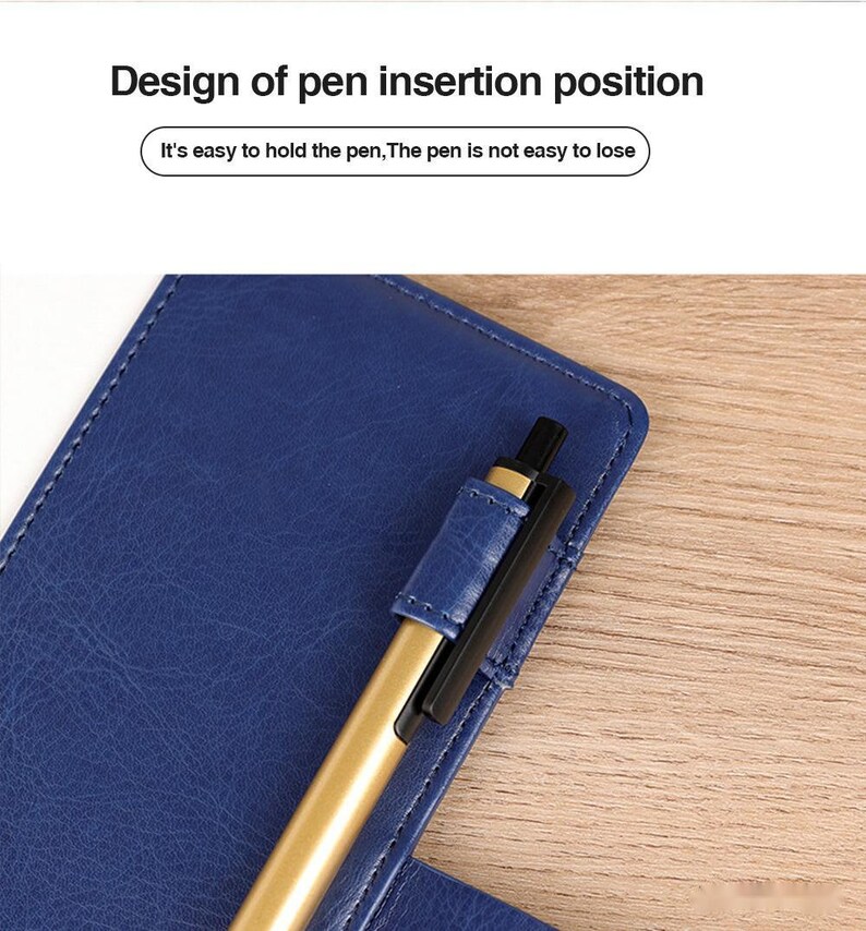 May include: A blue leather notebook with a gold pen inserted into a pen holder on the cover. The text "Design of pen insertion position" and "It's easy to hold the pen, The pen is not easy to lose" is visible on the image.