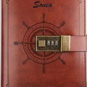 May include: A brown leather journal with a compass design and a combination lock. The journal has the words "Enjoy Your Time" and "Mariner Notebook" printed on it. The name "Sonia" is written on the front cover.
