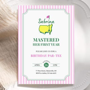 May include: A pink and white striped invitation card with a green border. The card features the name "Sabrina" above a yellow golf course graphic. Text reads "MASTERED HER FIRST YEAR" and "BIRTHDAY PAR-TEE". Includes date, time, and RSVP information.