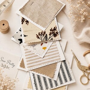 May include: A collection of fabric swatches with pinked edges, featuring various patterns including beige solids, floral prints, and black and white stripes. A measuring tape shows a length of 5 inches, and a card displays the text Sew Pretty.