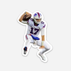 May include: A sticker featuring a football player in a white and blue uniform, number 17, throwing a football. The player is wearing a helmet with red, white, and blue accents. The sticker has a white border.