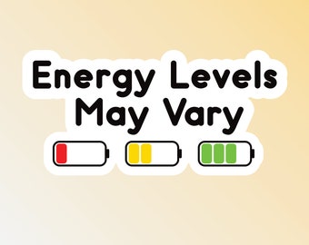 May include: A white sticker with black text that reads "Energy Levels May Vary". Three battery icons are shown below the text, one red, one yellow, and one green.