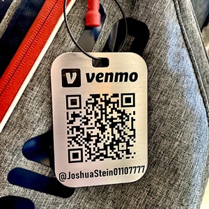 May include: A silver metal tag with a black QR code and the text "V venmo @JoshuaStein01107777".