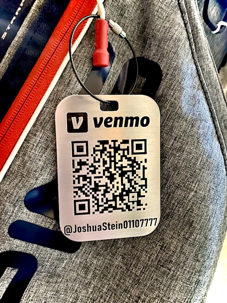 May include: A silver metal tag with a black QR code and the text "V venmo @JoshuaStein01107777".